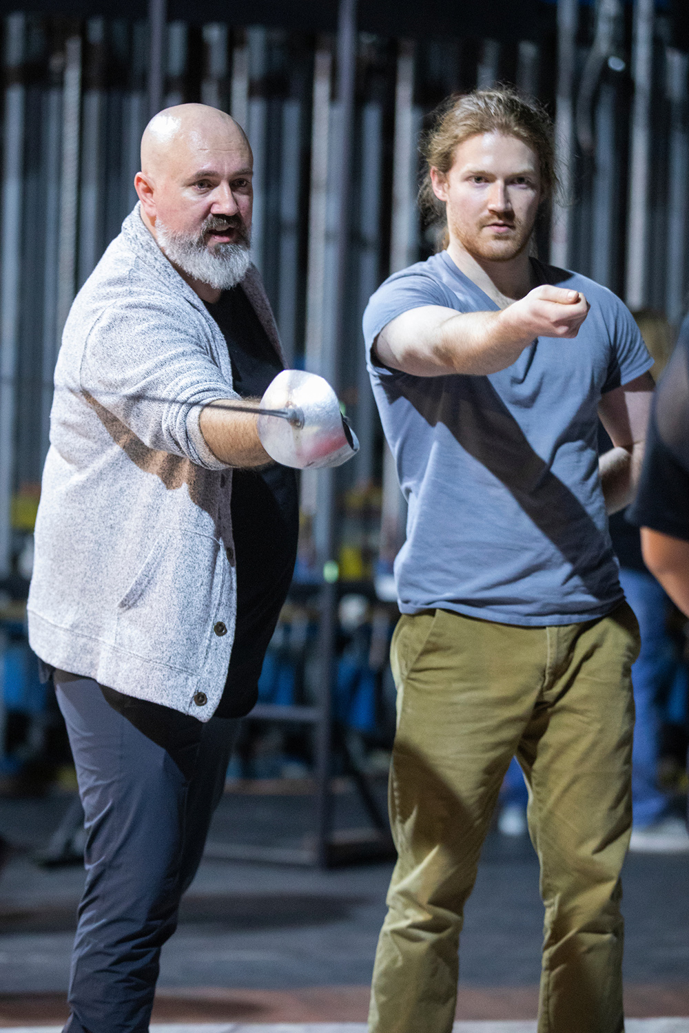 two people practicing stage combat