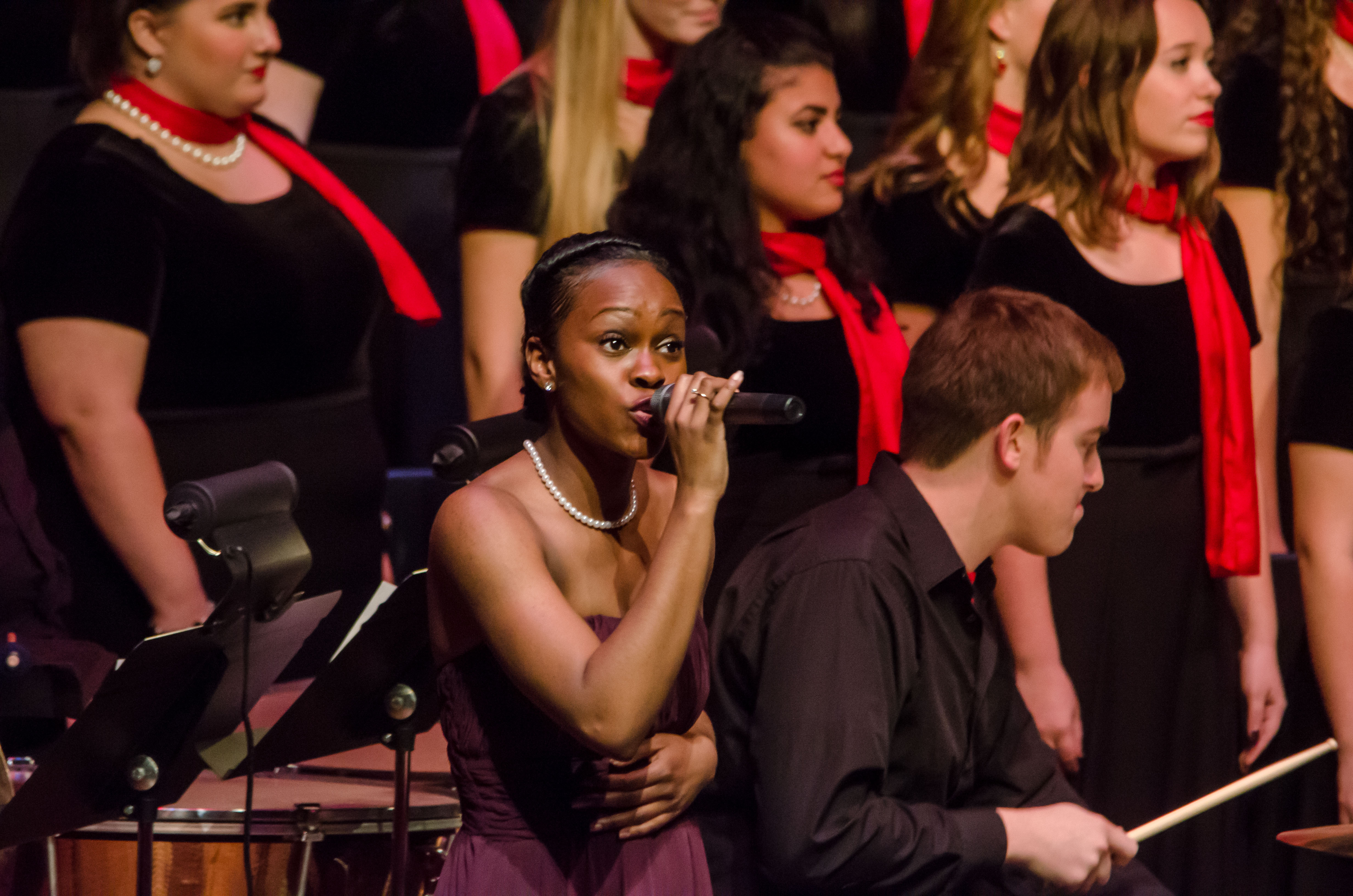 students singing with red scarf