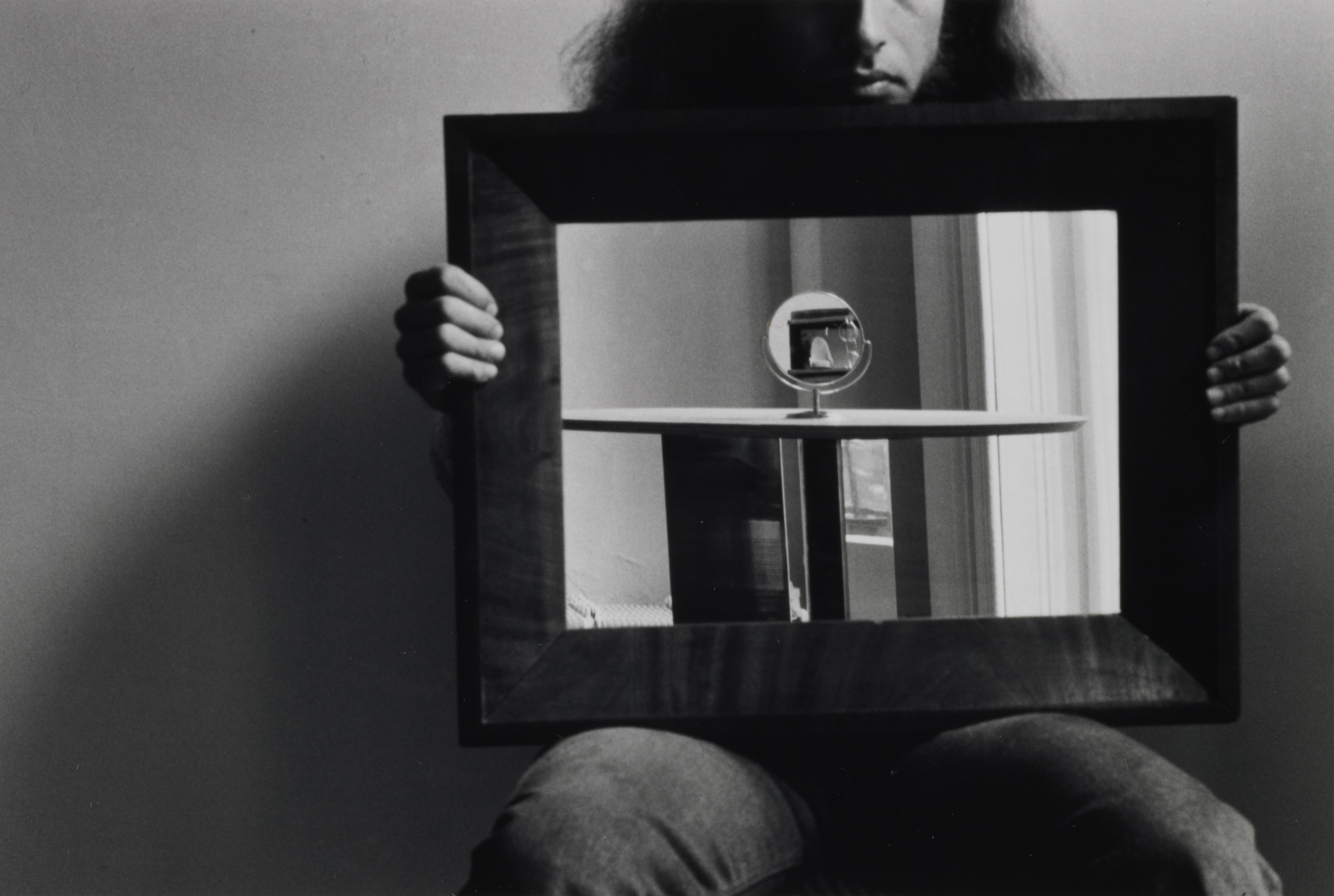 person holding mirror