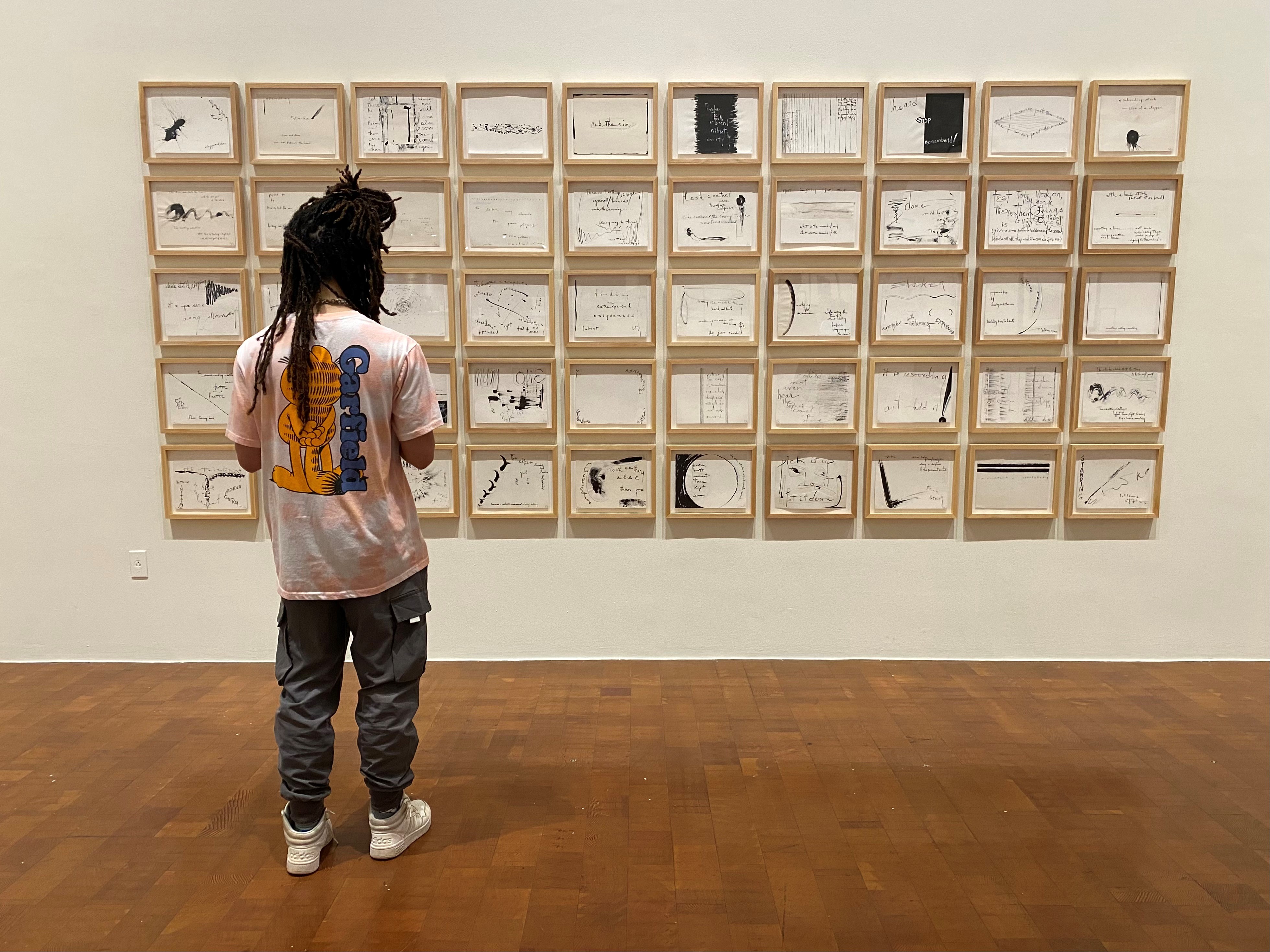 person looking at gallery wall