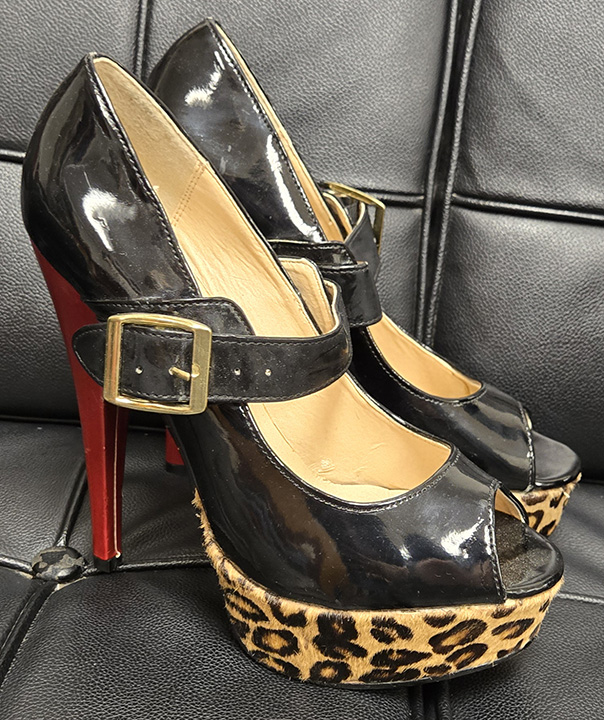 Image of black platform high heels with leopard wedge and red heel