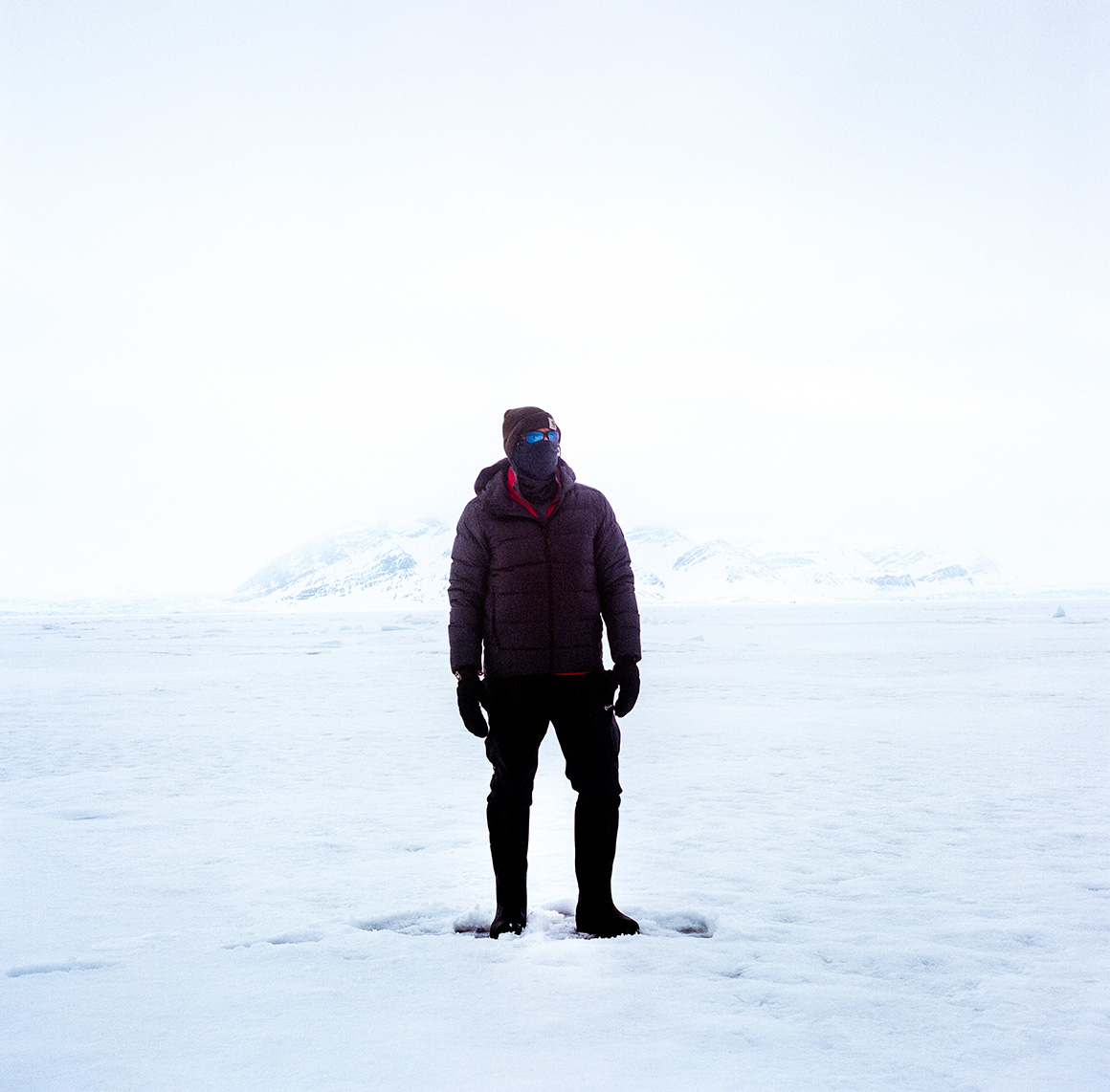 Person standing on snowy arctic background