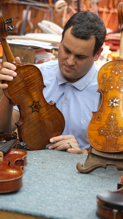 Avshalom Weinstein holding violin