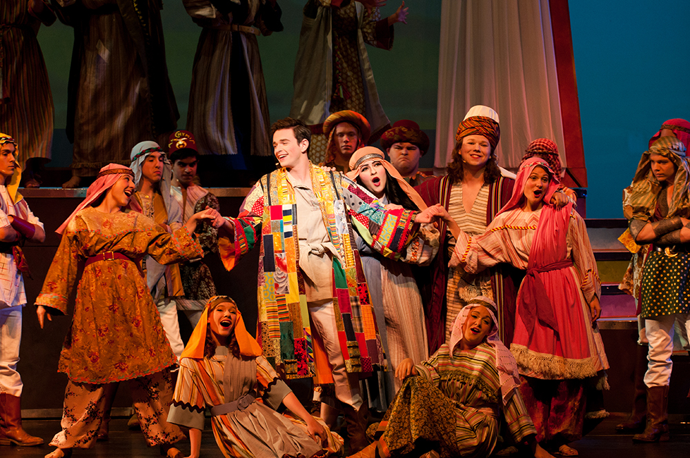 group of students on stage in Joseph and the Technicolor Dreamcoat