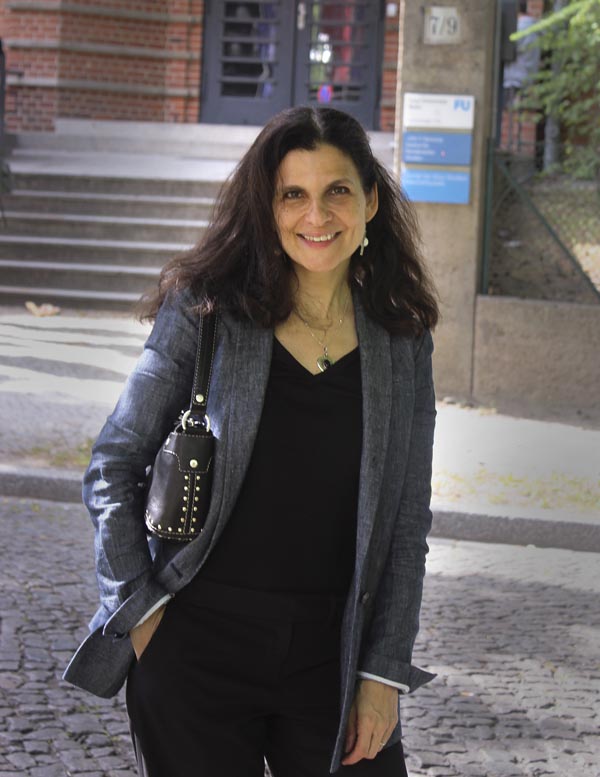 Photograph of Laura Katzman outdoors wearing dark clothes with grey blazer