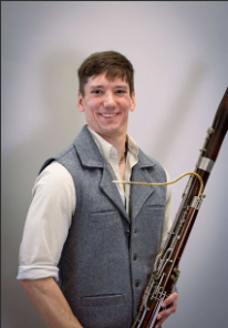 Portrait of Andrew payne holding a bassoon