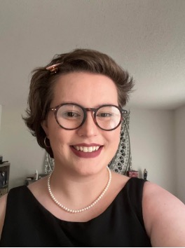 Smiling headshot of Thalia Ousley