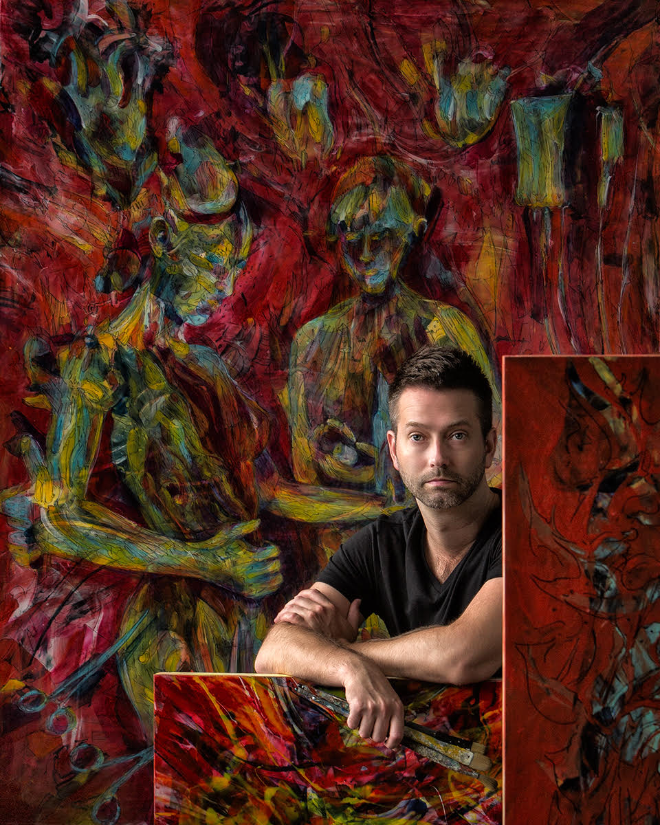 Lenon Michalski sitting in front of one of his paintings.