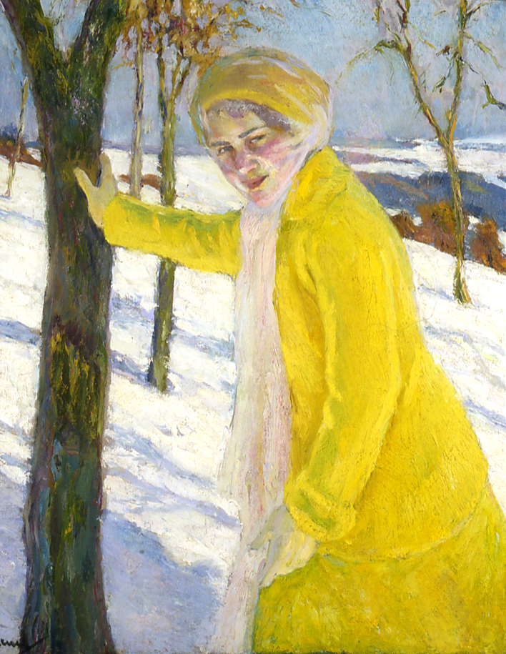 girl in yellow coat leaning on tree
