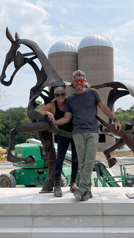 image of Hager and Vickery in front of sculpture