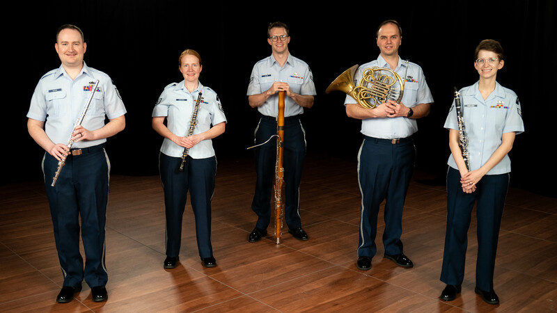 Image of the Midwest Winds quintet in Air Force uniforms holding their instruments.