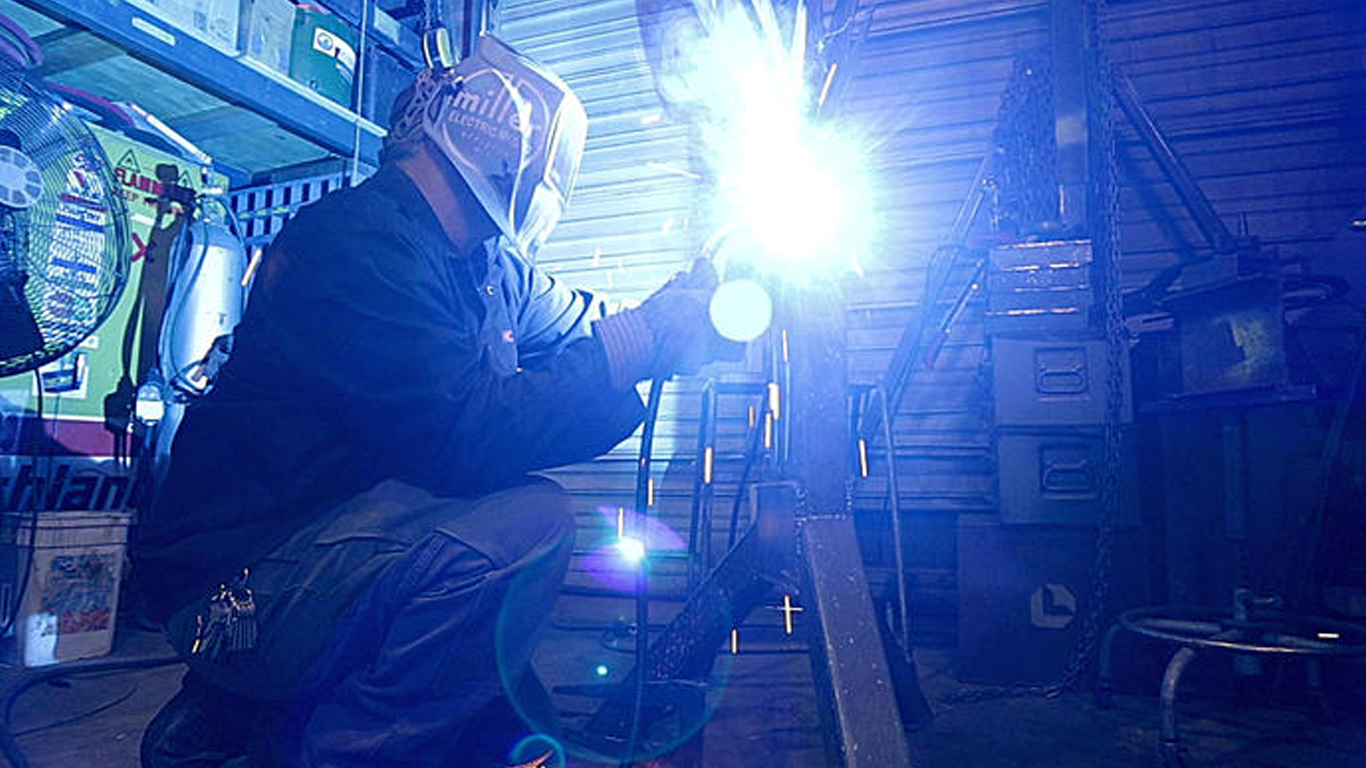 Image of Jeremy Colbert working on sculpture.