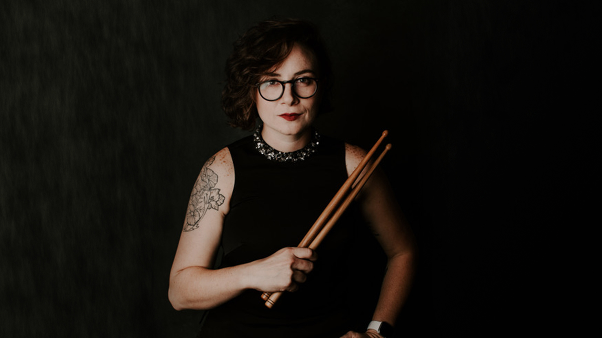 Image of Emily Durocher holding drum mallets 