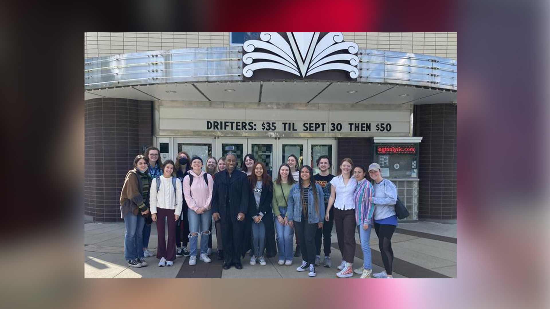 The arts administration students pose with Whitaker outside The Lyric entrance. Photo provided.