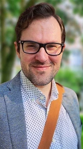 Headshot of Jason Rozenholtz-Witt
