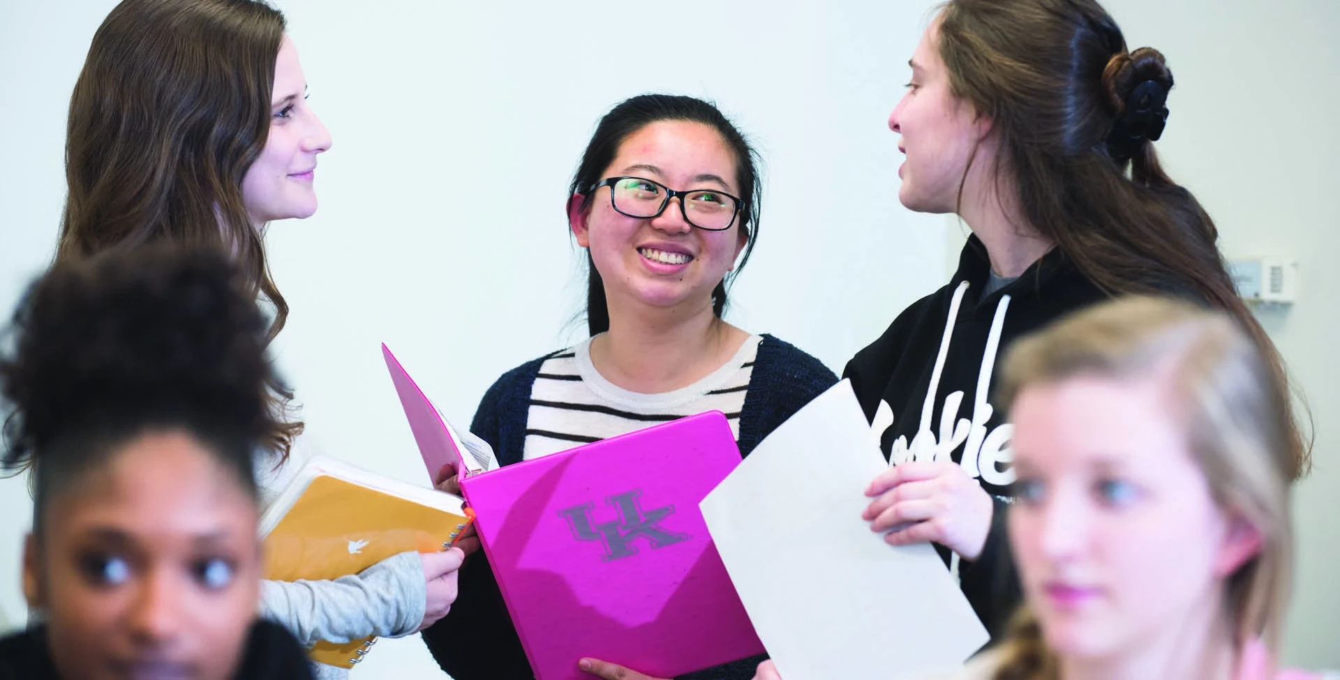 students talking in a classroom