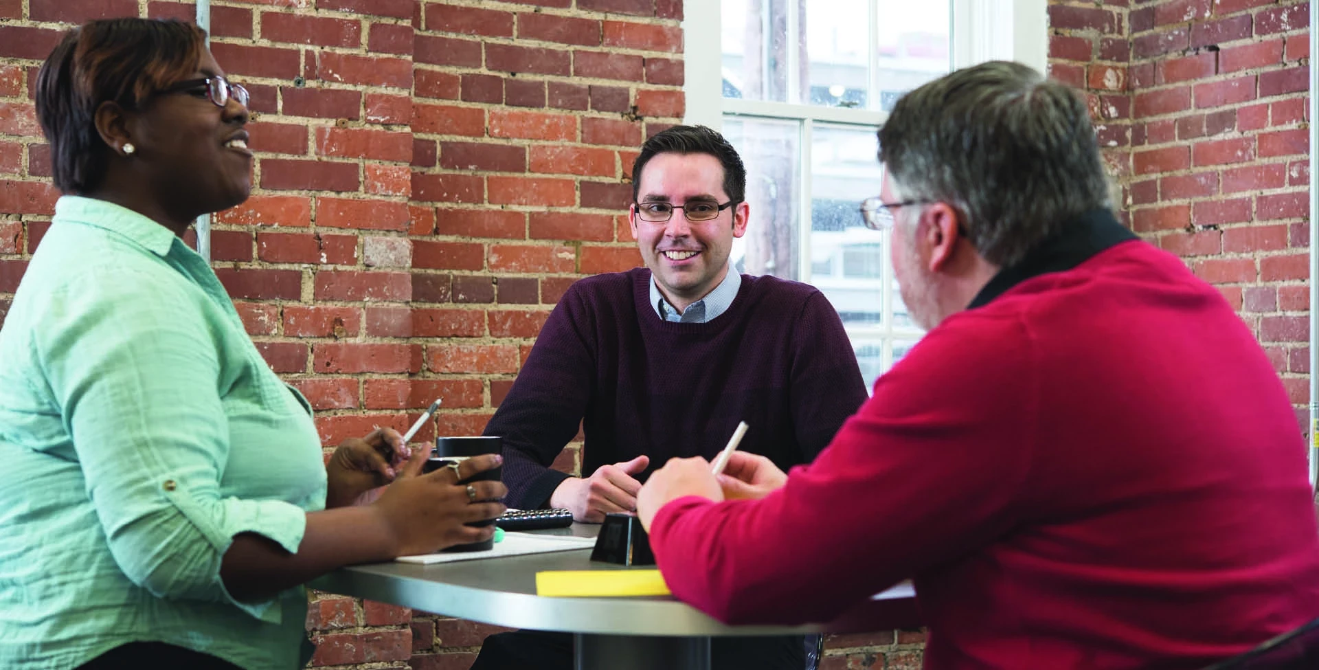 Graduate students at classroom table