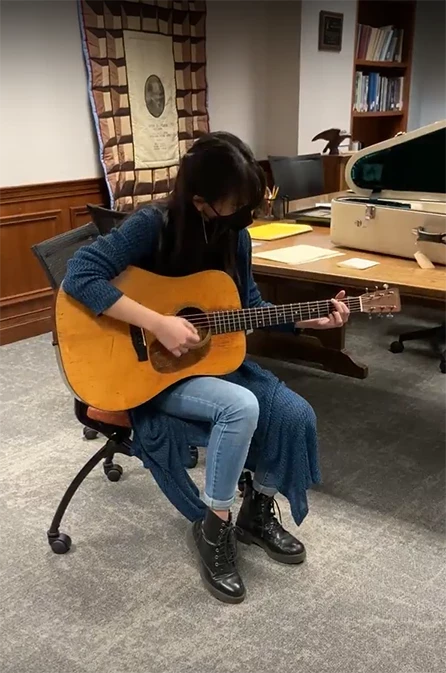 student playing guitar