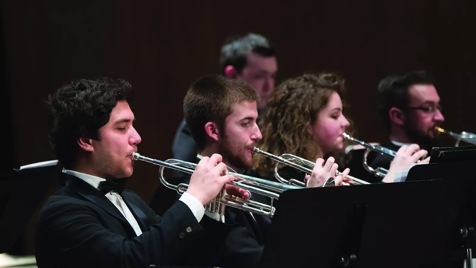 students playing instruments on stage