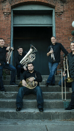 Boston Brass musicians on stoop