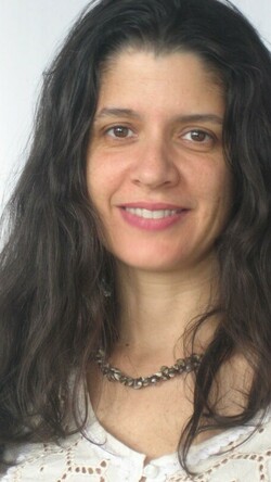 Headshot of Janine Antoni against a white backdrop