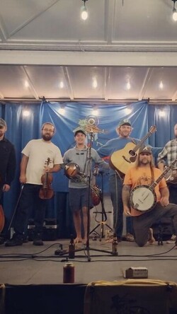 music group on stage with instruments