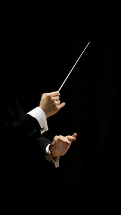 close up of hands conducting