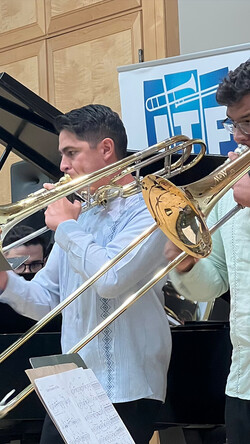 Image of Juan Saldivar, Jr. and Alex Lopez Velarde playing trombones