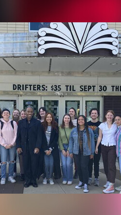 The arts administration students pose with Whitaker outside The Lyric entrance. Photo provided.