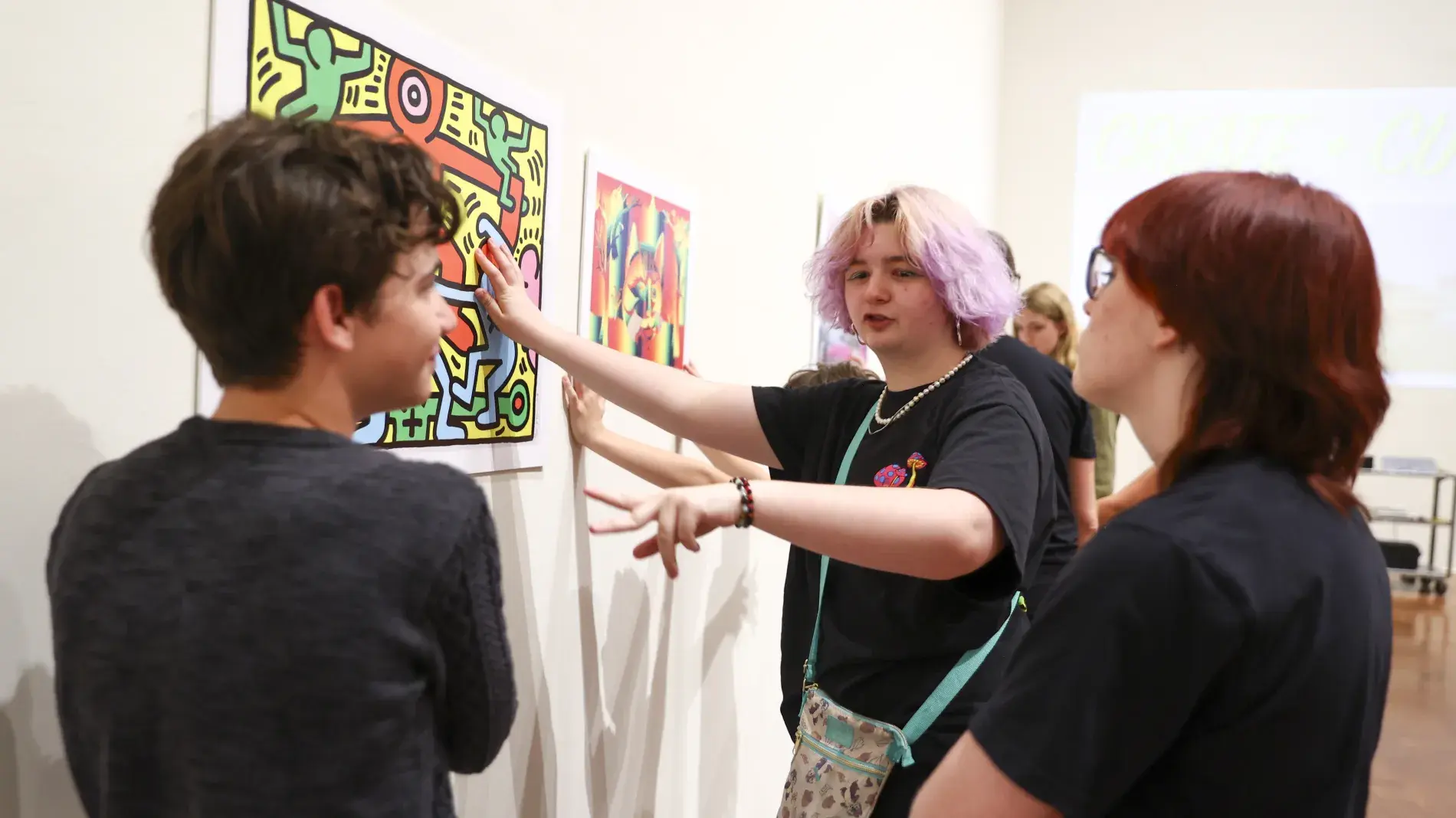 students looking at art in gallery