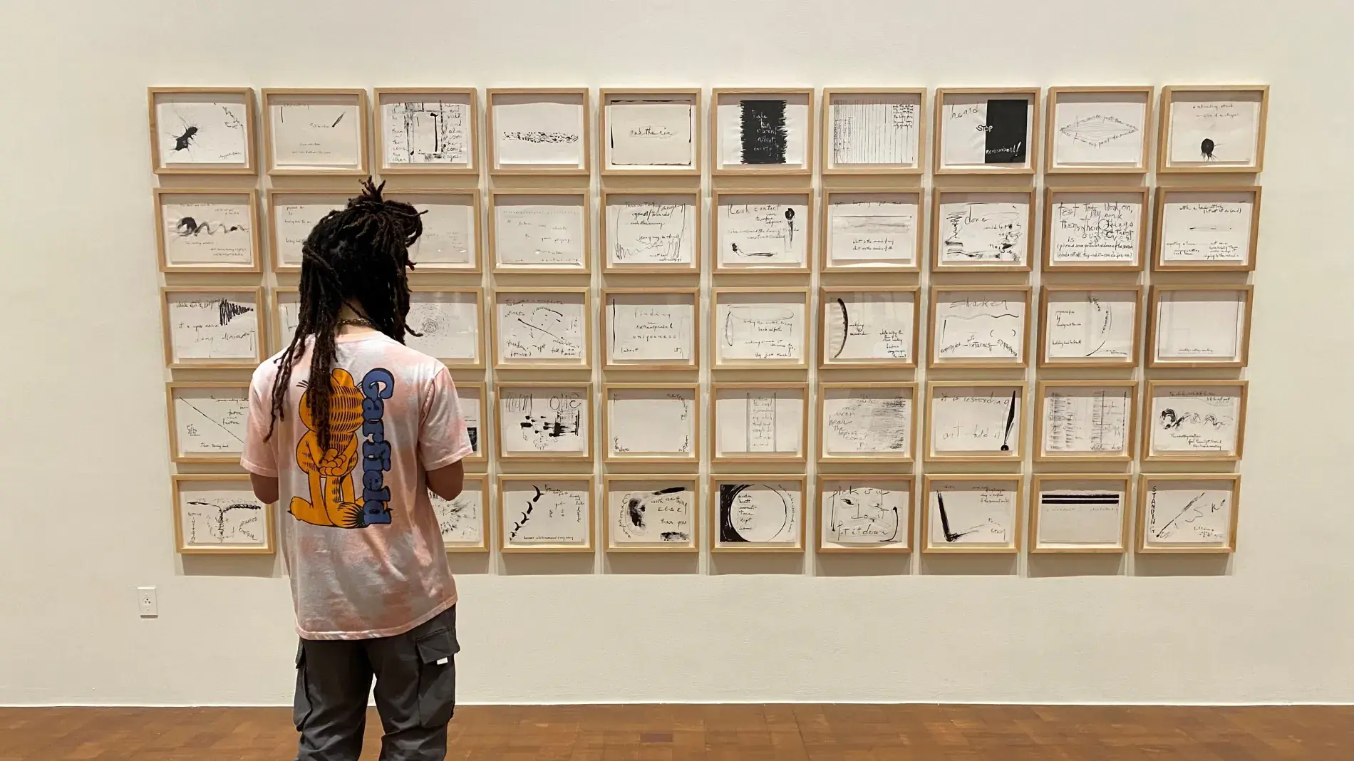 person looking at gallery wall
