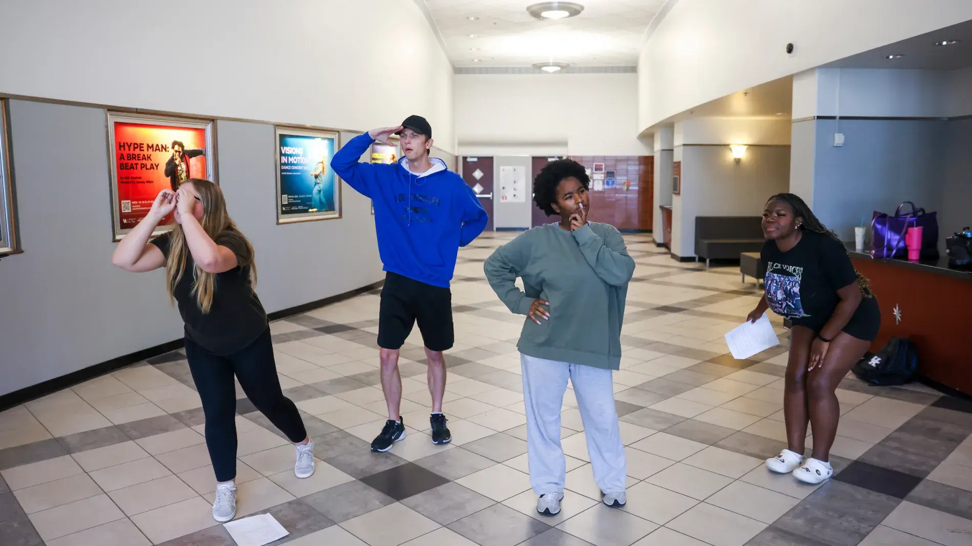 Students rehearse for the fall touring company show in the lobby of the Fine Arts building
