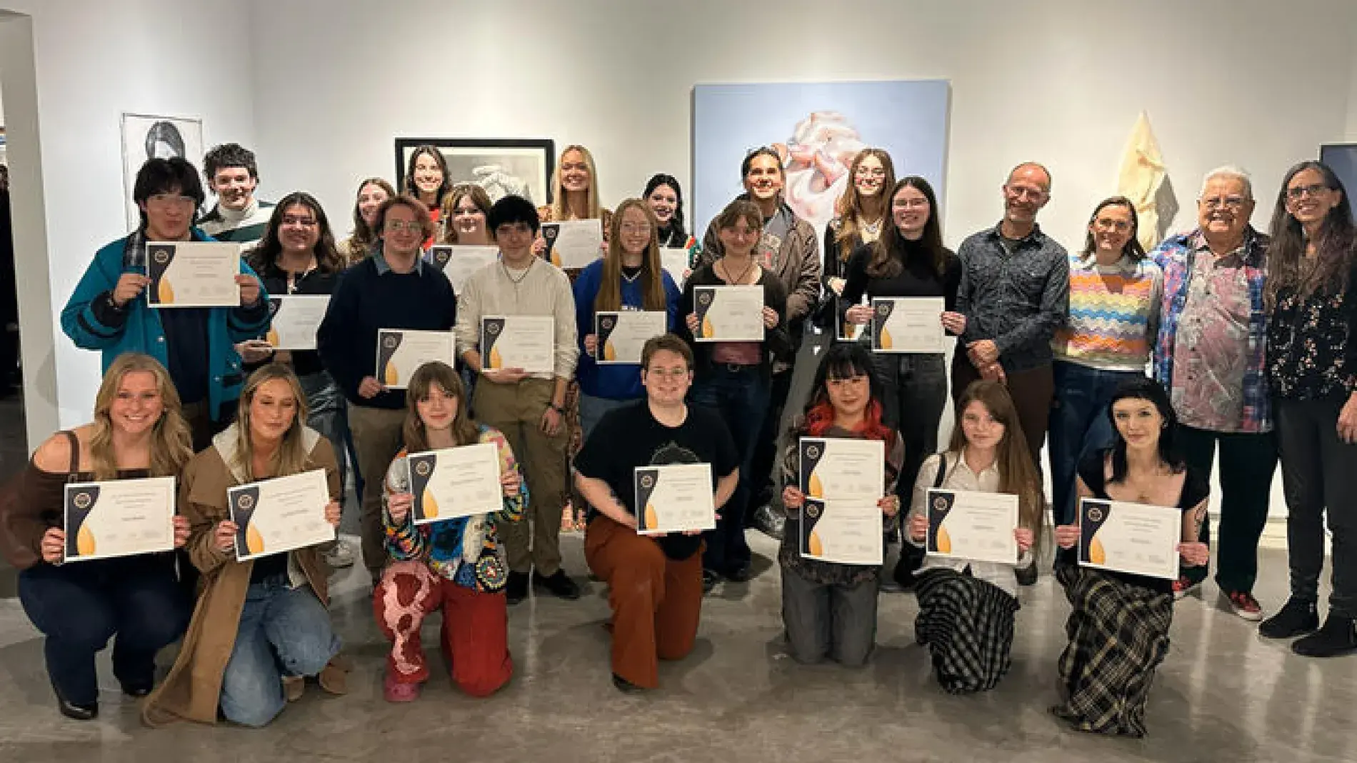 several students pose with awards from the Carey Ellis Juried Exhibition