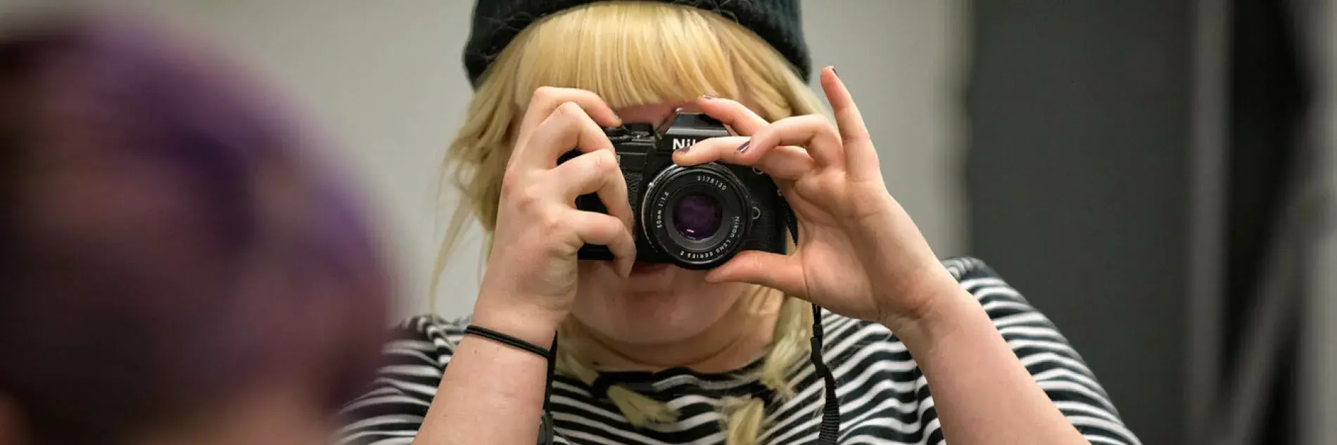 Person with camera pointed at camera