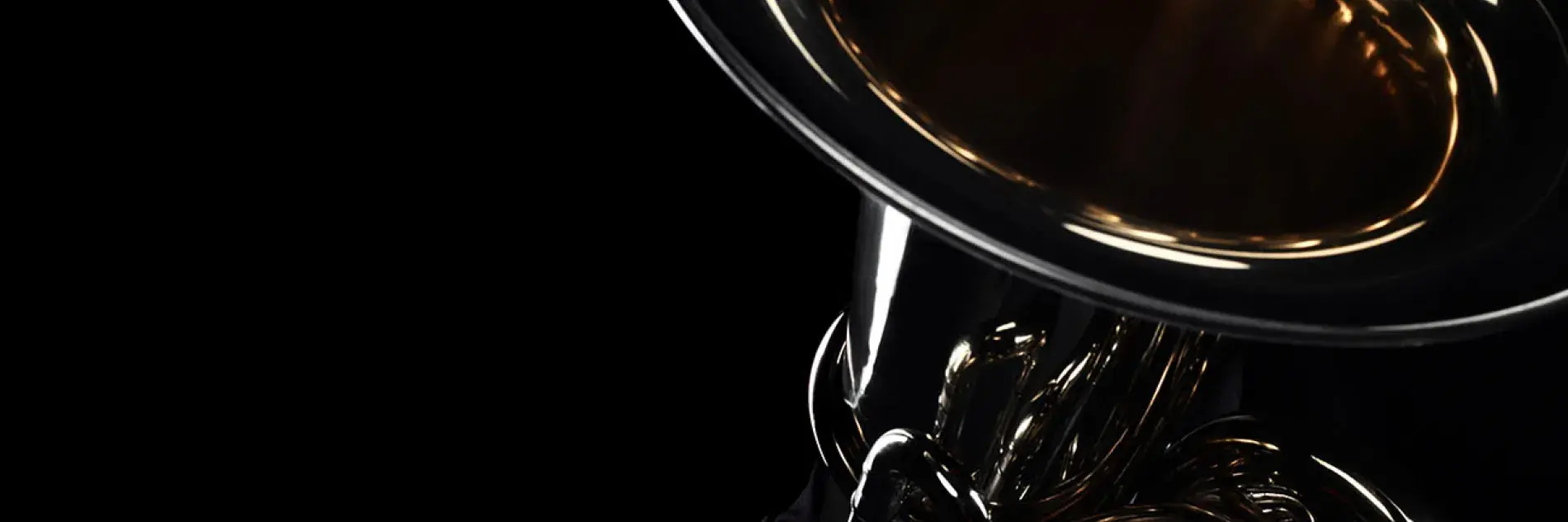 brass instrument on black background