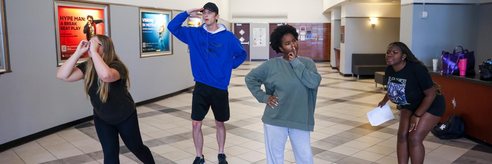 Students rehearse for the fall touring company show in the lobby of the Fine Arts building