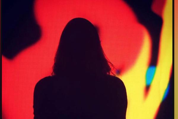 silhouette of person on red abstract background
