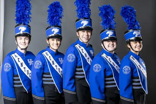 five people in line with blue band uniforms