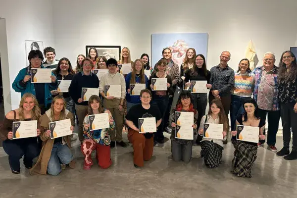 several students pose with awards from the Carey Ellis Juried Exhibition