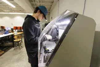 student at 3d printer