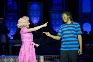 two singers on stage
