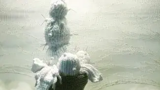 Fiber basket and white sculptures