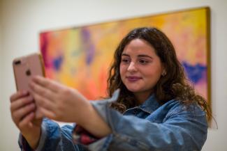 person taking selfie in museum