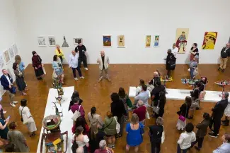 many people in art museum during reception