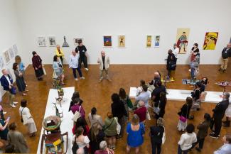 many people in art museum during reception