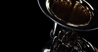 brass instrument on black background