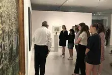 dancers looking at art in berlin gallery