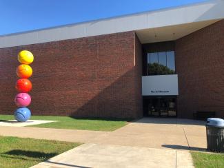 Art Museum outside door with emoji sculpture