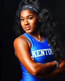 Headshot of Darci Kahn, wearing UK uniform against black backdrop