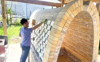 Image of student constructing new kiln
